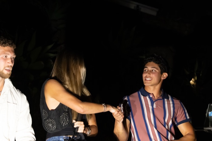 Eris shaking Camilo's hand right after taking off her blindfold