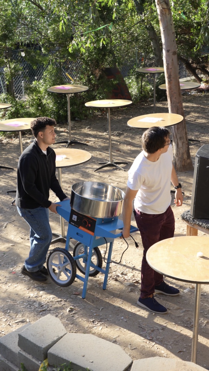 Brian and Jacob moving the cotton candy machine into place before the show